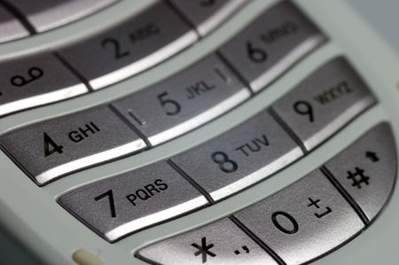 A closeup of a keypad on a mobile phoneの写真素材