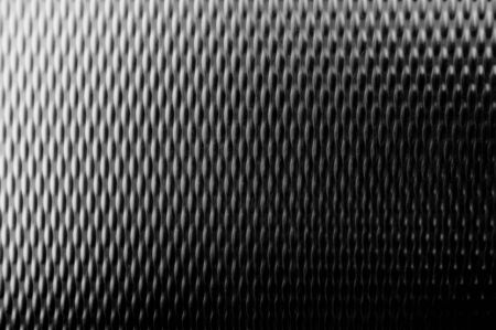 A stainless steel pattern with scratches and an intresting lightningの写真素材