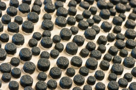 Black dots in a uneven pattern, looking strange.の写真素材