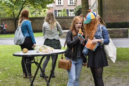Breda, The Netherlands - September 5, 2015: Two ladies with red hear and colored cap is exposing on the RedHead Daysのeditorial素材