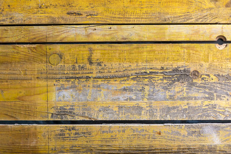 Textured yellow Background from old, used wooden panelsの写真素材