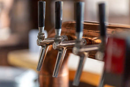 close-up of a beer-tapping plant in restaurant with brewery in Germany. verticalの写真素材
