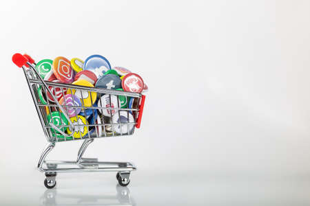 Shopping cart with logos such as facebook, instgram, youtube and whatsapp symbolizes the business with social media. Horizontalのeditorial素材