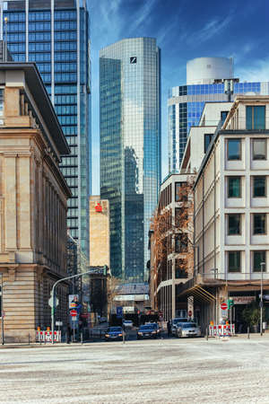 Building of the Deutsche Bank and others with company logo in the financial district of Frankfurt, Germany on 02/11/2021. Verticalのeditorial素材