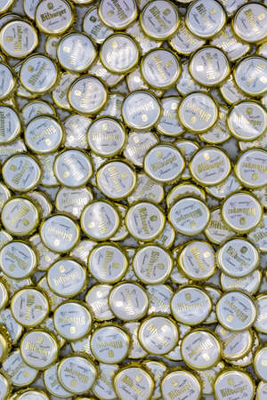 Textured background with beer bottle caps from brewing company Bitburger, January 28th, 2021 in Bad Homburg, Germany. Verticalのeditorial素材