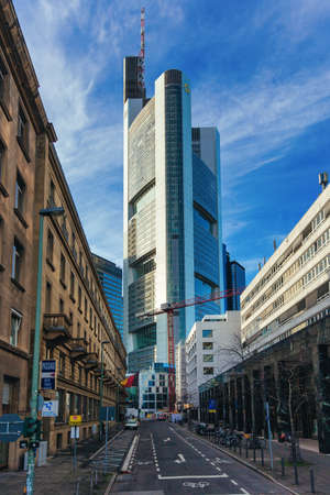 Financial district with Commerzbank Tower in the center with blue sky taken in Frankfurt, Germany on February 4th 2021. Businessのeditorial素材