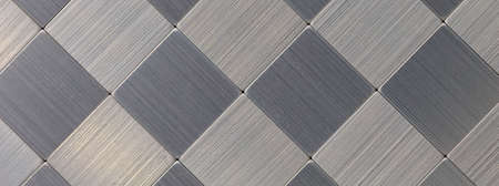Silver background made of different surfaces in brushed aluminum in panorama format for industry, technology and metal construction. panoramic horizontalの写真素材