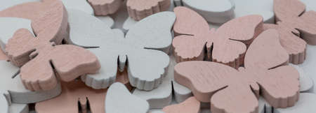 butterflies made of wood to spring as background in the colors white and gray. panoramaの写真素材
