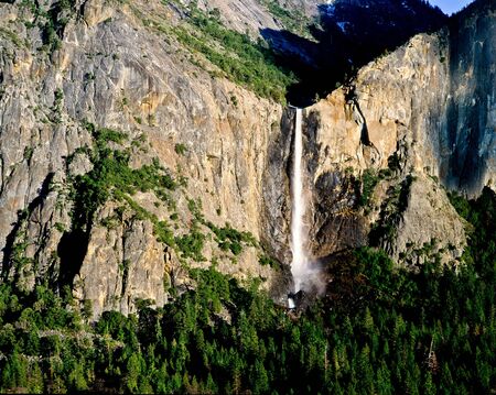 Late afternoon light illuminates Bridalveil Fall in Yosemite Valley, Yosemite National Park の写真素材