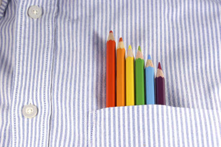 Colored pencils in shirt pocket                 の写真素材