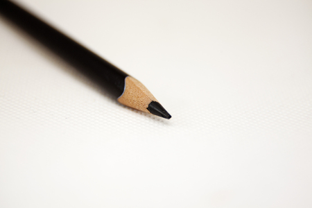 black pen tip on white background and pencilの写真素材