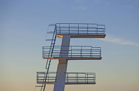 swimming jumping tower in sunsetの写真素材