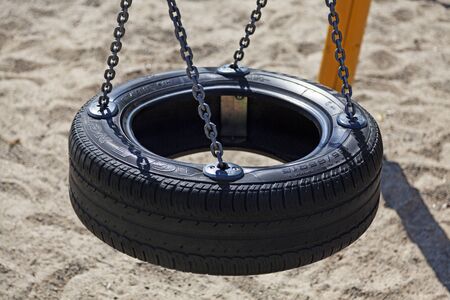 Umea, Sweden - July 22, 2019: child swing at playground in Robackのeditorial素材