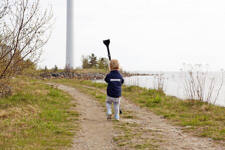Holmsund, Sweden - May 2, 2019: on the run with dad's crutch near the seaのeditorial素材