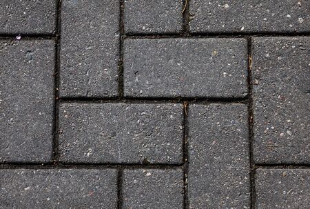 paving laid in geometric pattern, stone textureの写真素材