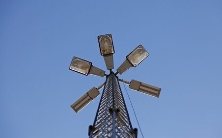 lights in towers against blue sky