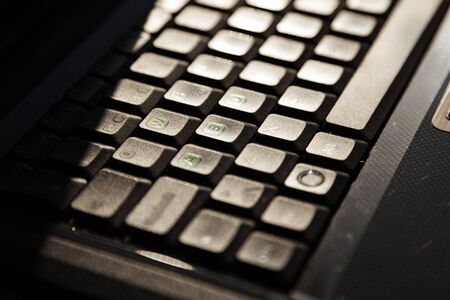 keyboard from laptop computer seen from the side in bright sunlight