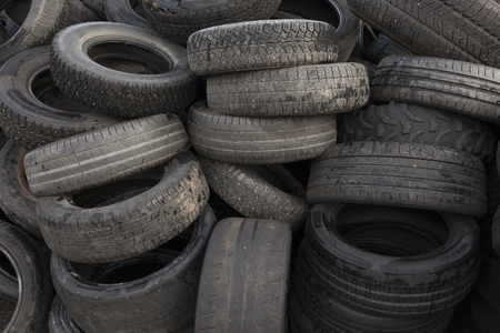 Umea, Sweden - August 20, 2019: a pile of old used car tires to be recycled to new tiresのeditorial素材