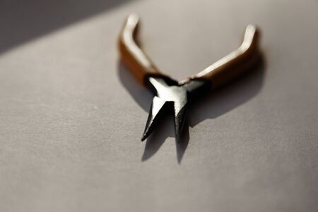 a pliers lying in the windowsill during sunsetの写真素材