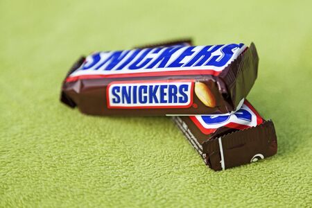 Umea, Norrland Sweden - October 3, 2019: two chocolate bars on a green backgroundのeditorial素材