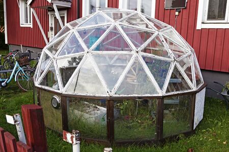 Umea, Norrland Sweden - October 9, 2019: spherical greenhouse stands on lawn in front of a townhouseのeditorial素材