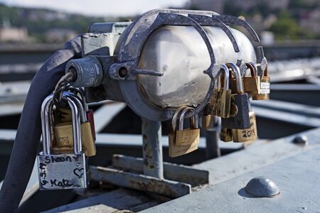 Budapest, Hungary - May 25, 2019: several locks symbolizing love attached to bridgeのeditorial素材