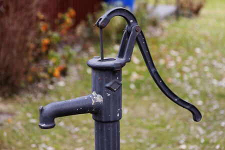 hand-operated water pump with long handle, water from a deep well at Robackの写真素材