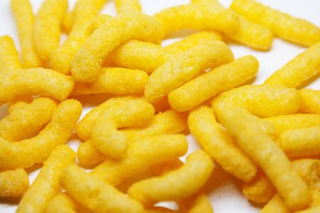 lots of cheese arches and doodles lying on a white background