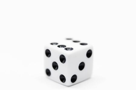 a plain white dice on white background in close upの写真素材