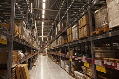 Umea, Norrland Sweden - January 9, 2020: a large warehouse with packages in yellow toneのeditorial素材