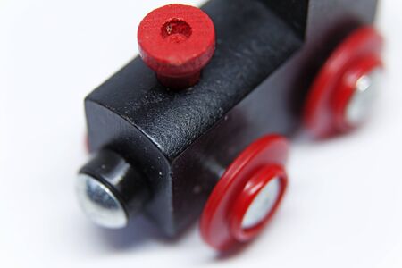 black and red wooden toy train seen from aboveの写真素材