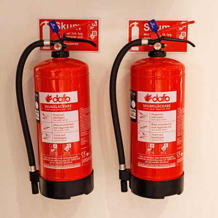 Umea, Norrland Sweden - March 5, 2020: two fire extinguishers with foam in the mall