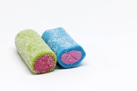 a blue and green candy roll on white backgroundの写真素材
