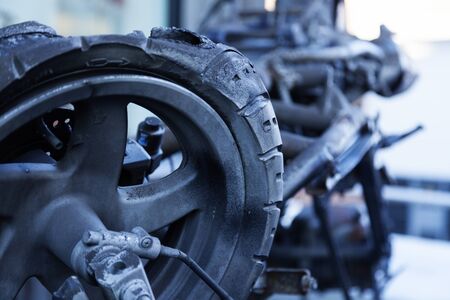 part of broken moped wheel and other metal debris