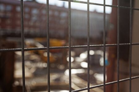behind the fence to a construction site in Umea