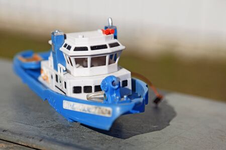 a toy boat in blue and white plasticの写真素材