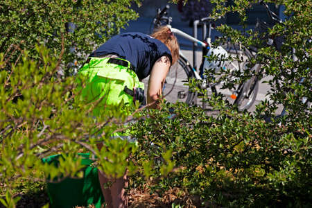Umea, Norrland Sweden - June 4, 2020: girl works with park maintenanceのeditorial素材