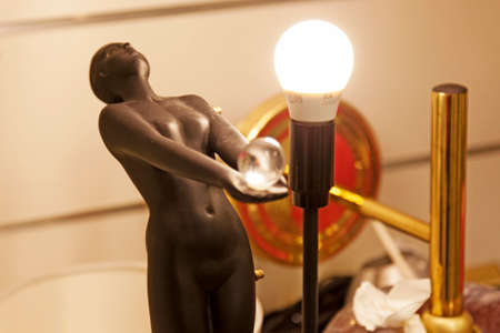 Umea, Norrland Sweden - March 17, 2020: statue of naked woman with lamp at flea marketのeditorial素材