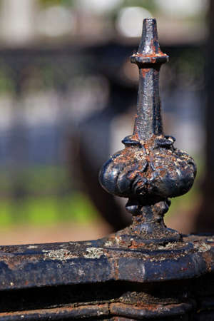 metal knob on railing to family grave