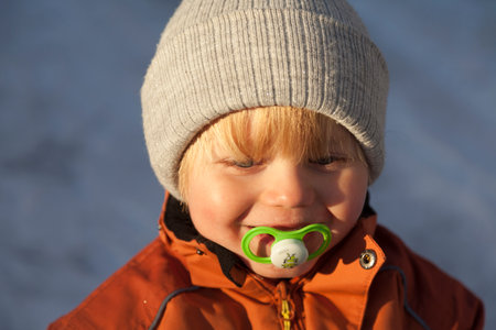 Umea, Norrland Sweden - November 24, 2020: winter sun shines on little boyのeditorial素材