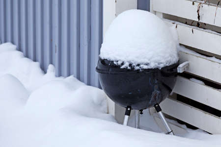 a barbecue that has been covered in snowの写真素材