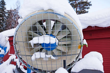 large snow cannon used on ski slopes seen from the front