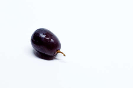 a red grape on a white backgroundの写真素材