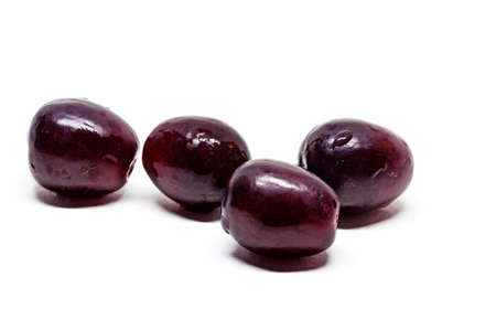 many red grapes on white backgroundの写真素材