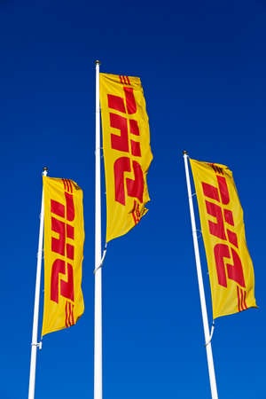 Umea, Norrland Sweden - March 19, 2021: three flags with a well-known transport company logo
