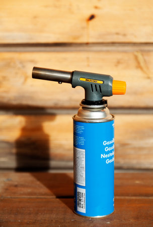 Umea, Norrland Sweden - April 7, 2021: blue gas container by the fireplace in the spring sunのeditorial素材