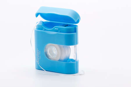 Umea, Norrland Sweden - May 11, 2021: dental floss on a roller against a white backgroundのeditorial素材
