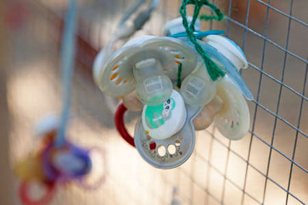 Umea, Norrland Sweden - July 4, 2021: pacifiers that children have lost or thrown away