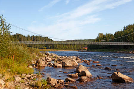 Umea, Norrland Sweden - August 14, 2019: suspension bridge over the Ume Riverの写真素材
