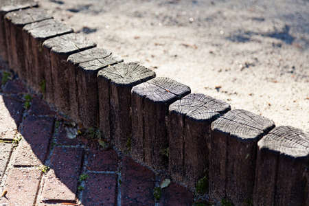 wooden edge to a sandbox outdoorsの写真素材